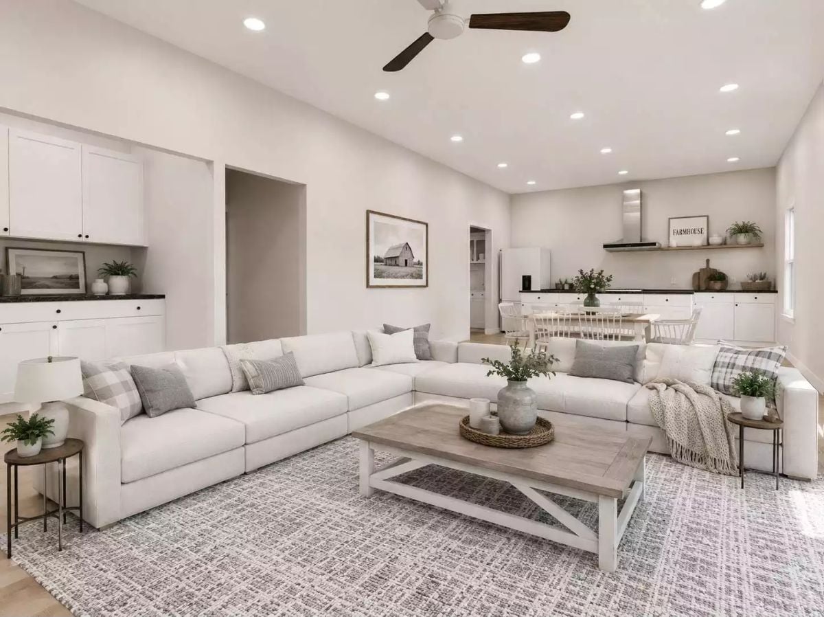 Cream Sectional, Farmhouse Coffee Table, Open Kitchen Behind — Family Rooms Don't Get More Livable
