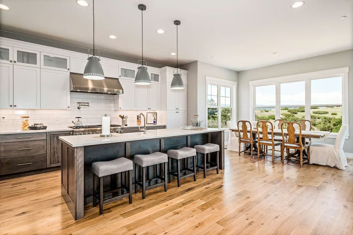 Gray Pendants and a Dark Island Base Ground a Kitchen Built for Serious Cooks
