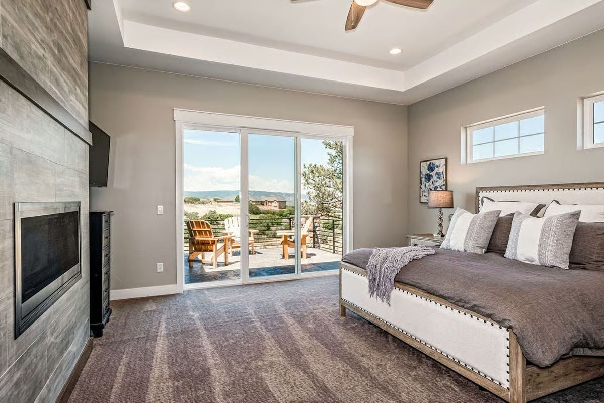 Tray Ceiling, Tiled Fireplace Wall, and a Deck View That Earns Its Square Footage