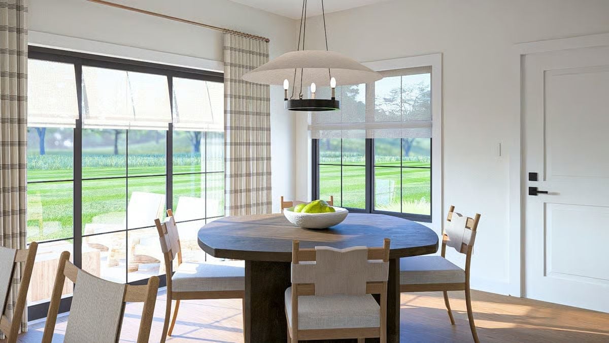 Round Table, Plaid Curtains, and a View That Does Most of the Work