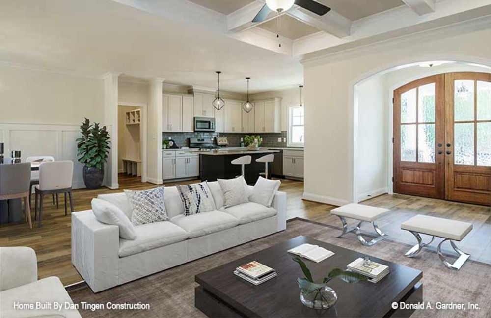 Coffered Ceilings, White Sofas, and a Kitchen That Stays in the Conversation