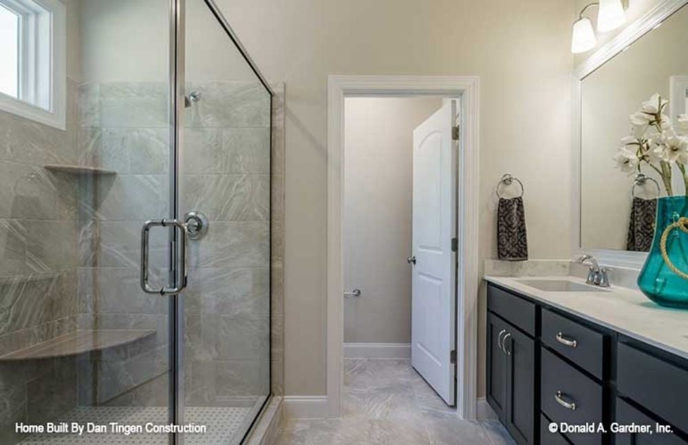 Dark Vanity Cabinets, Glass Shower, and a Layout That Earns Its Square Footage