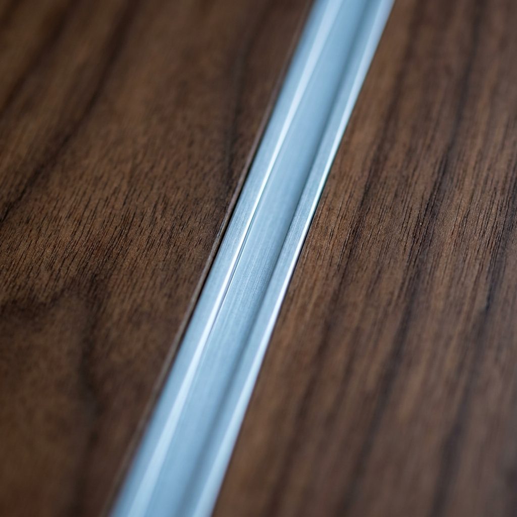 The Thin Aluminum Channel That Held Two Panels Together and Tried to Look Intentional