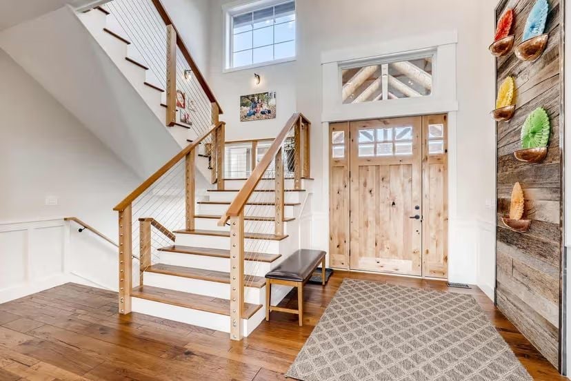 Cable Railings and Raw Wood Set the Tone Before You Take a Step