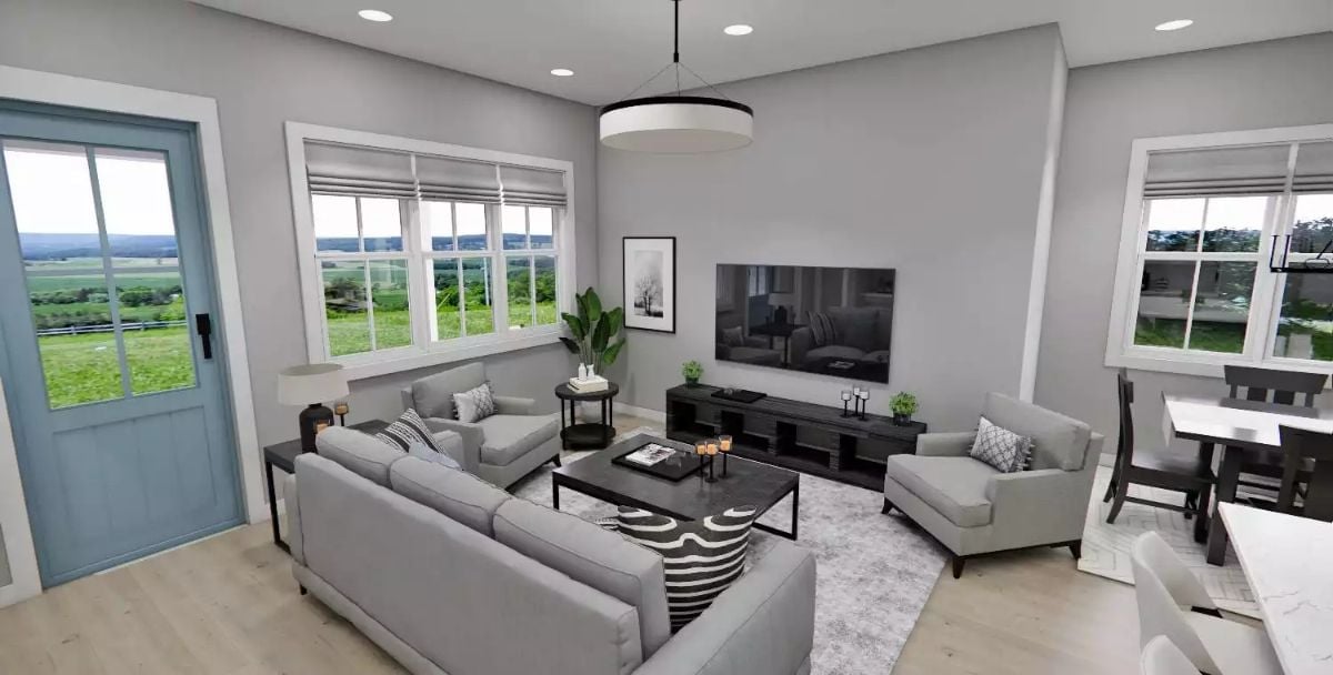 Gray Sectional, Black Coffee Table, and a Blue Door That Sets the Tone Early