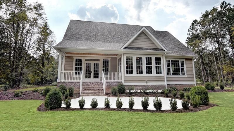 Brick Foundation, Front Porch, and That Row of Shrubs Doing Real Work