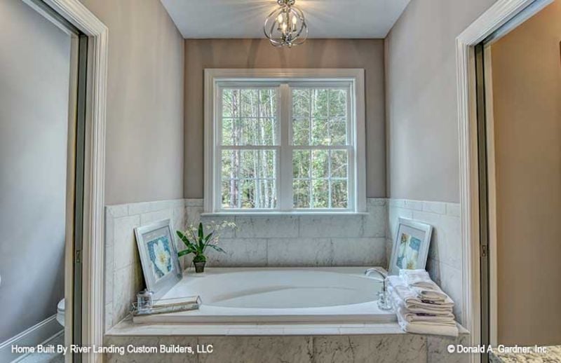 Marble Surround, Orchid on the Ledge, and a Window Worth Soaking Under