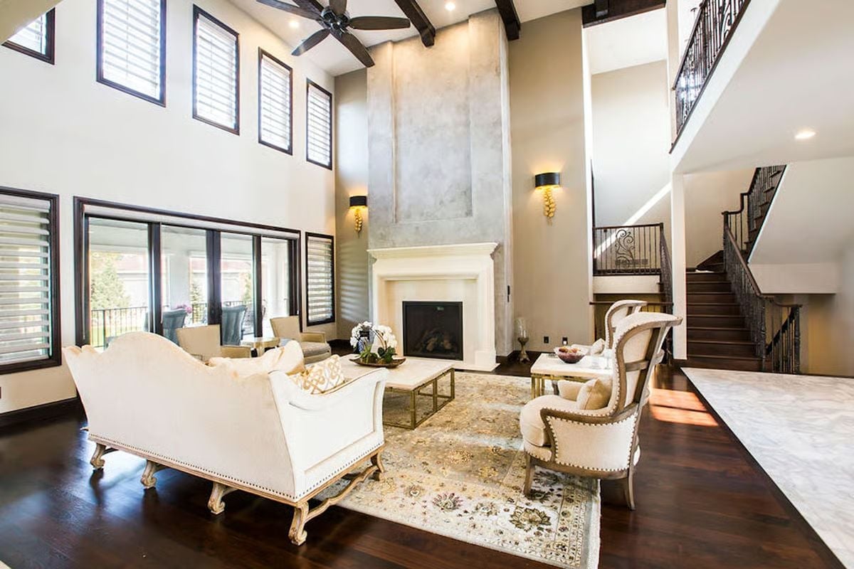 Double-Height Fireplace Surround With Venetian Plaster That Earns Every Inch of Wall