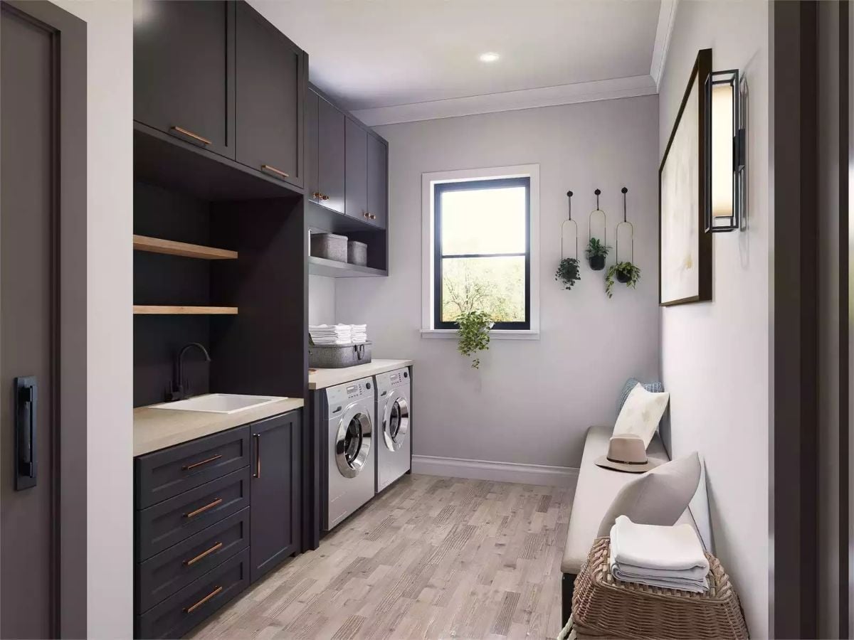 Charcoal Cabinets and Copper Pulls Make This Laundry Room Hard to Rush Through