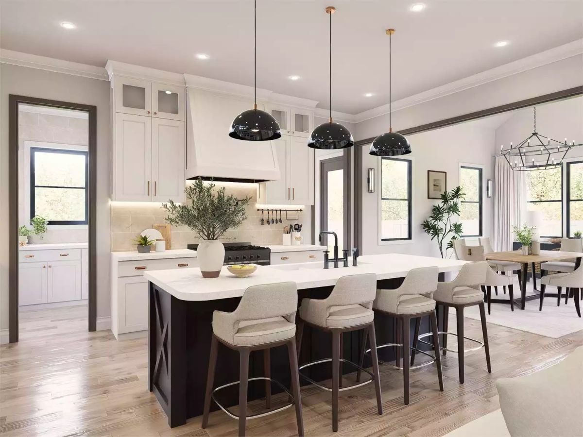 Dark Island Base Against White Cabinetry Makes the Contrast Do the Work