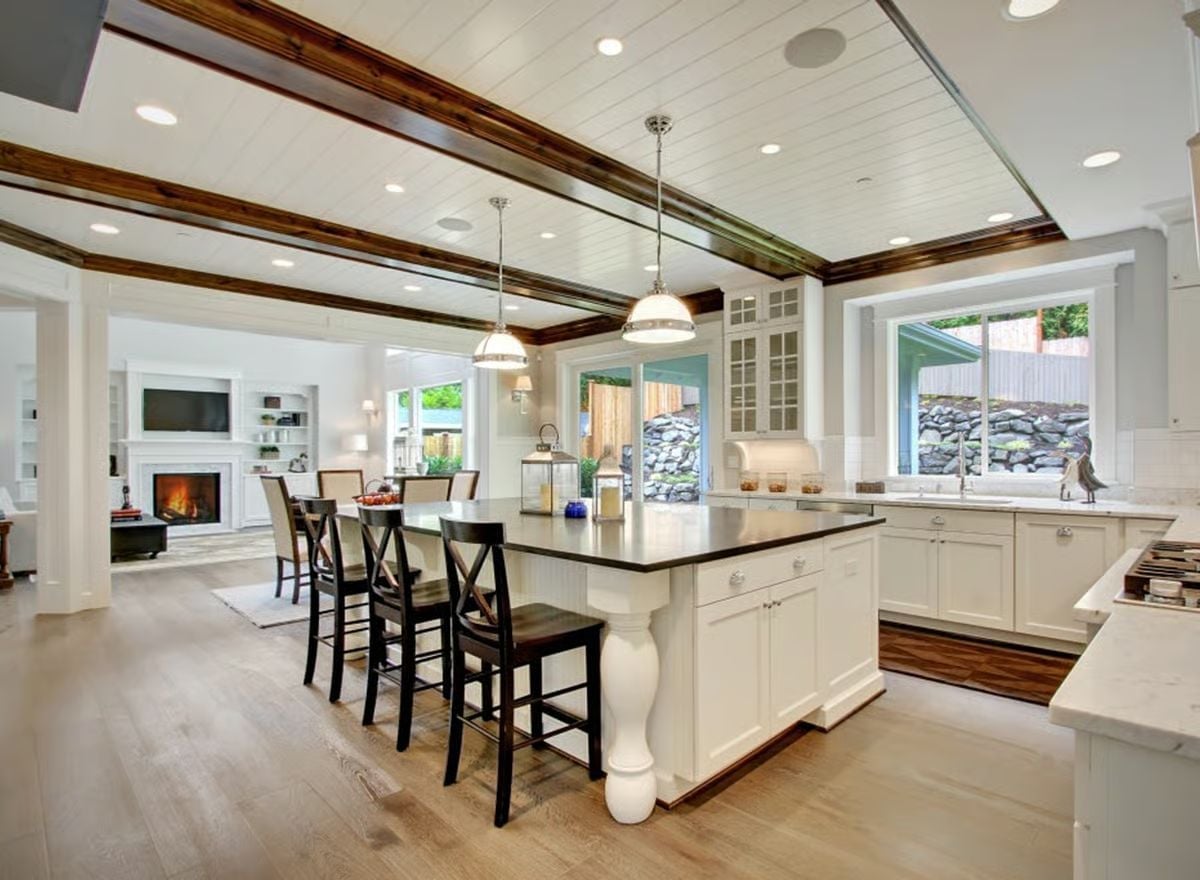 Dark Beams, White Cabinets, and an Island That Earns Every Square Foot