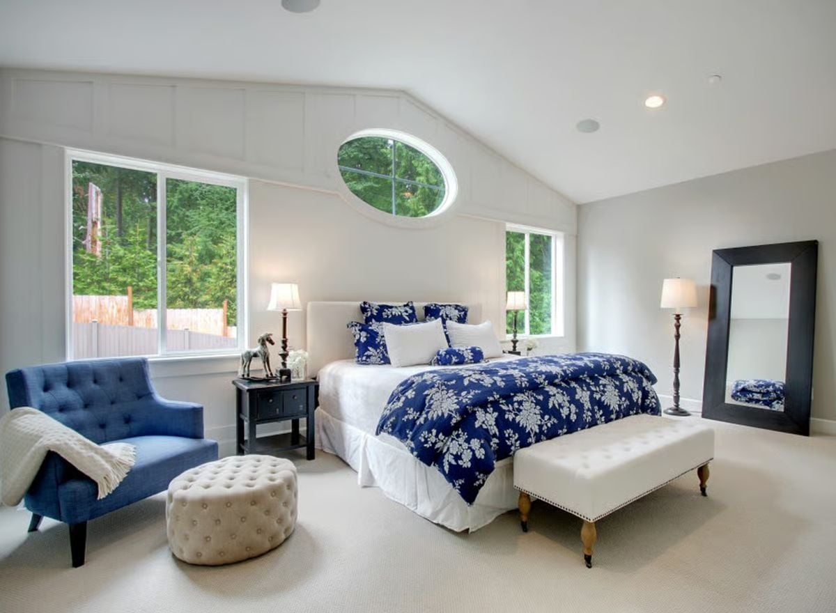 Navy Florals, a Tufted Bench, and an Oval Window Nobody Expects