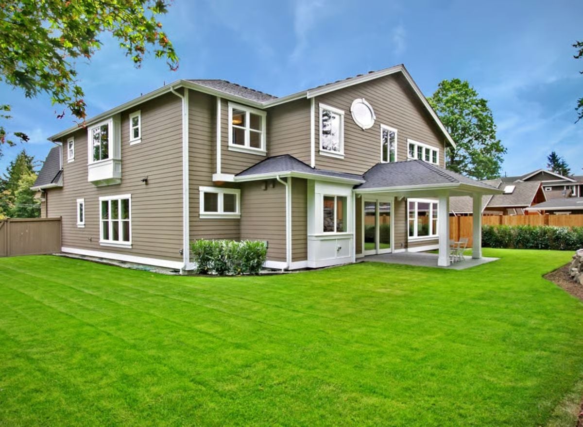 Taupe Siding, White Trim, and a Covered Patio Built for Year-Round Use