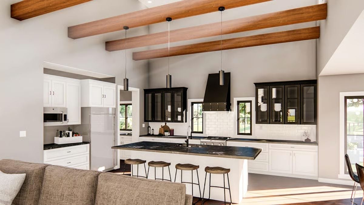 Black Cabinets and a Waterfall Island Keep This Kitchen Grounded