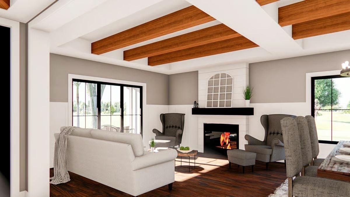 Exposed Ceiling Beams and a Lit Fireplace Pull the Whole Room Together