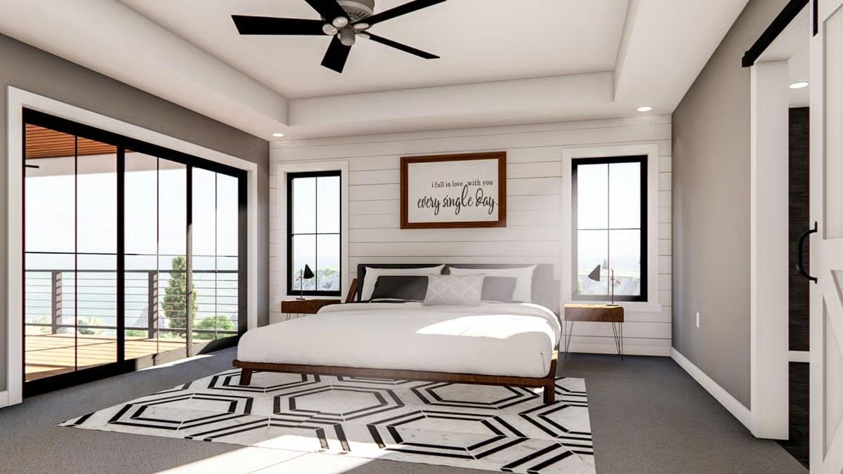 Shiplap Accent Wall and a Sliding Barn Door Keep This Master Bedroom Grounded