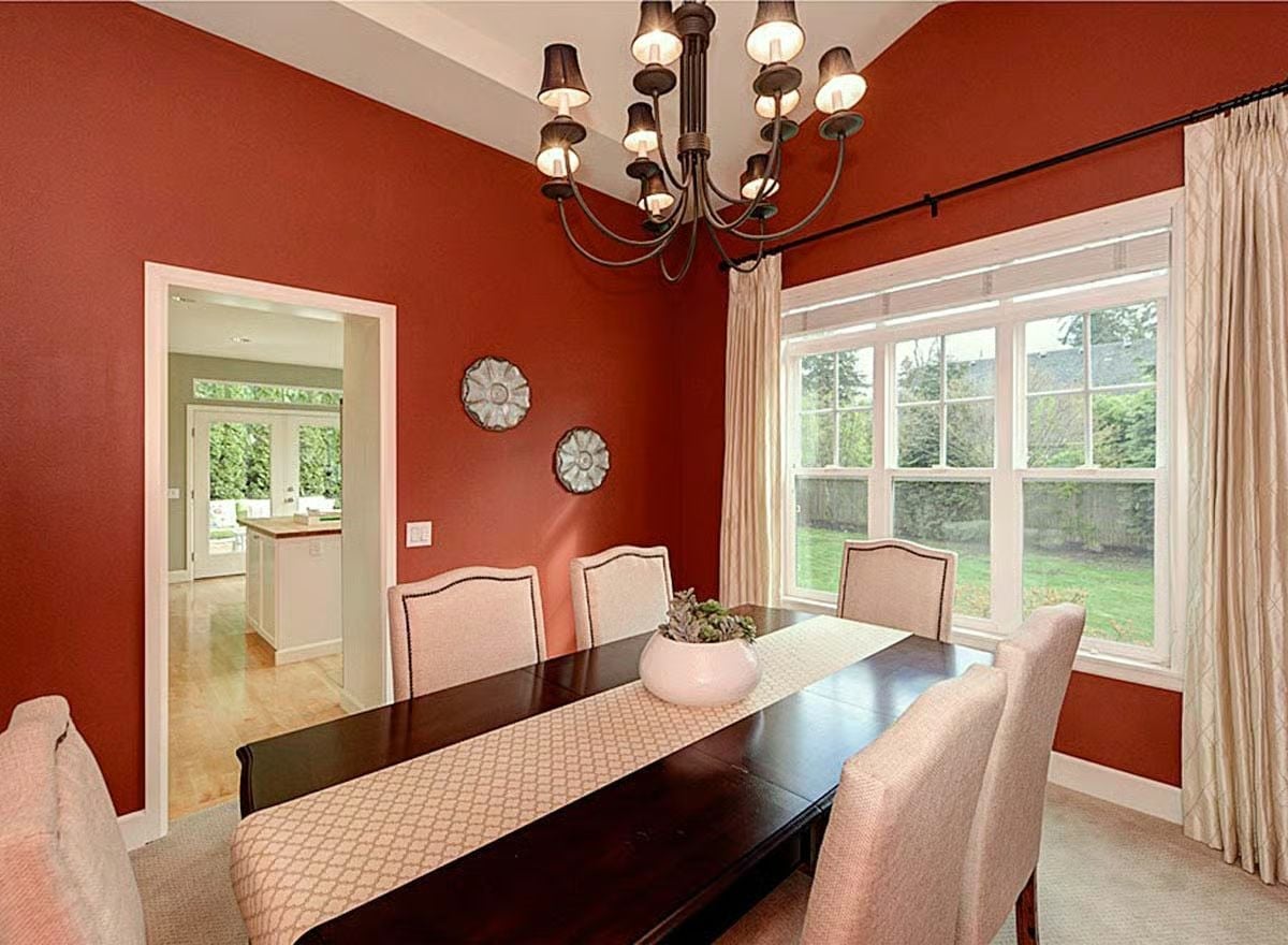 Bold Red Walls and a Dark Table That Know Exactly What They're Doing