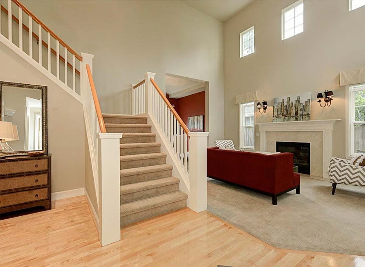 Soaring Ceilings and a Red Sofa That Actually Earns Its Place