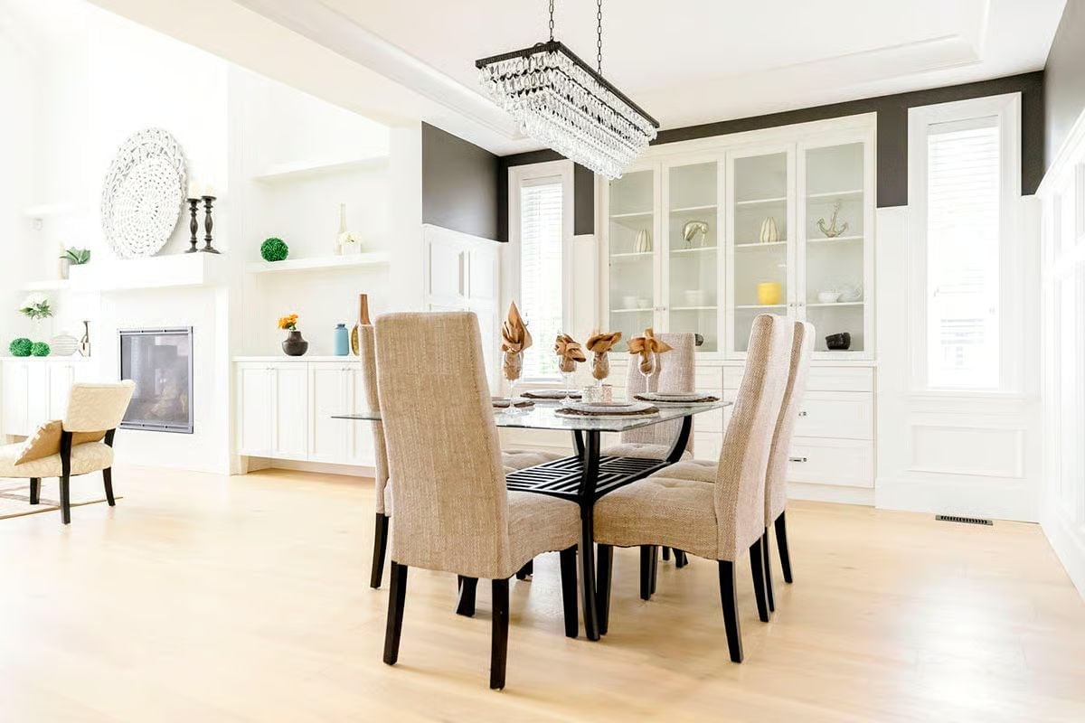 Crystal Drops, Linen Chairs, and a Glass Table That Refuses to Crowd the Room