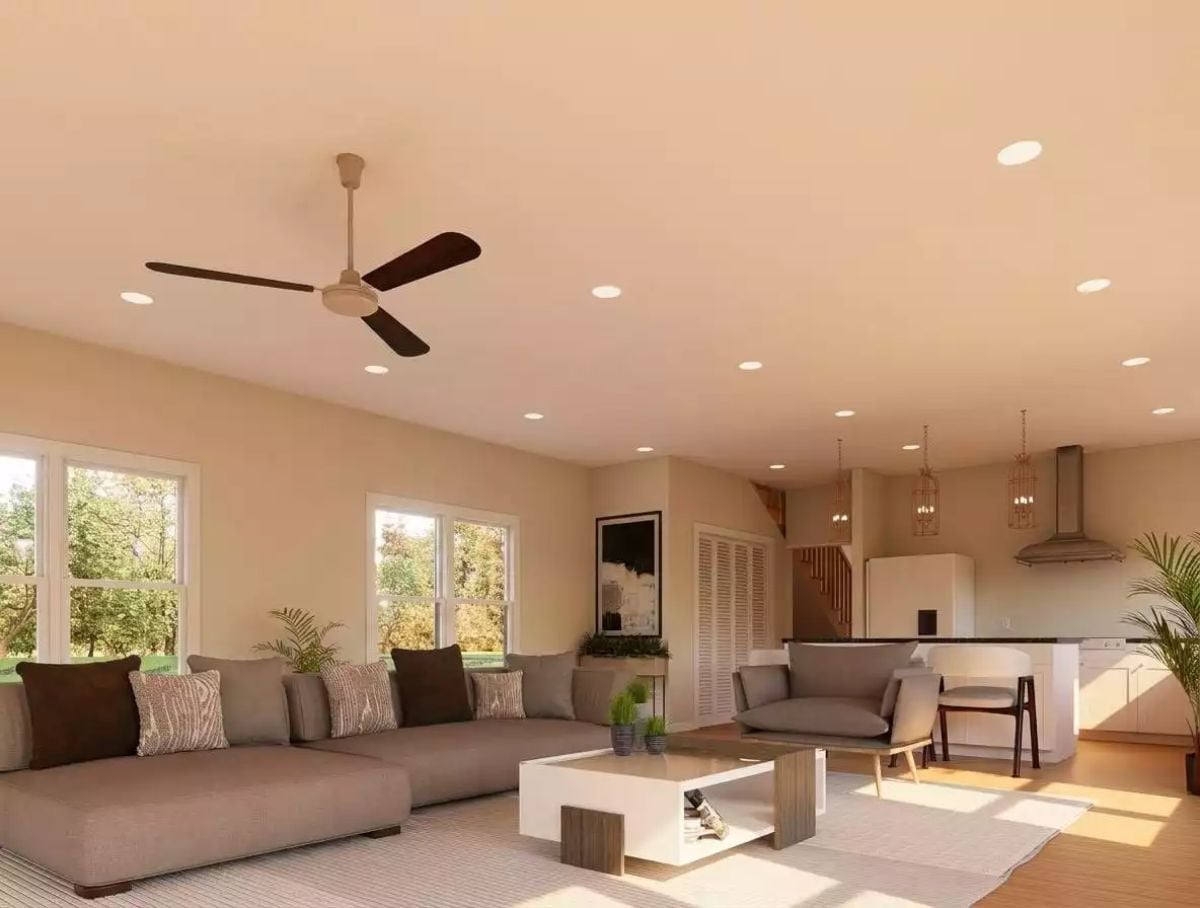 Warm Recessed Lighting and Dark Fan Blades Give This Living Room Real Staying Power