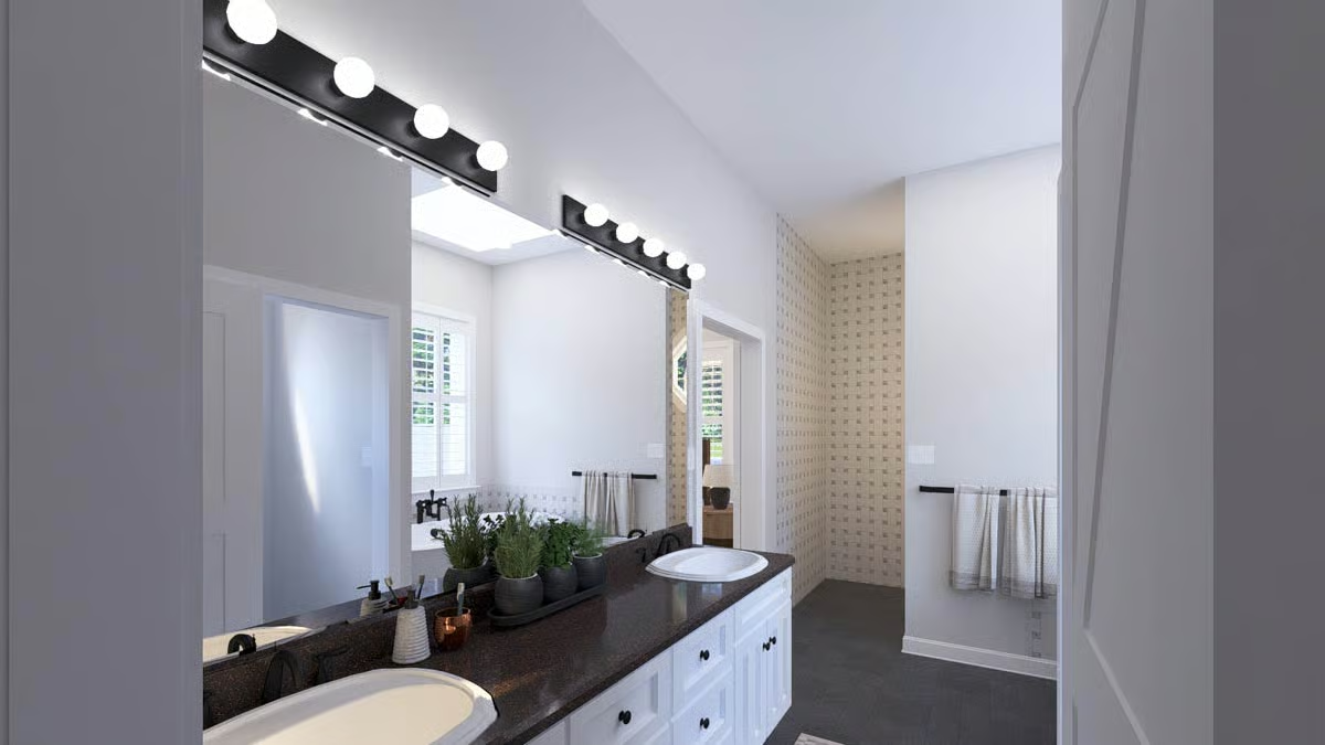 Hollywood Vanity Lighting Over Dark Granite That's Doing a Lot of Work