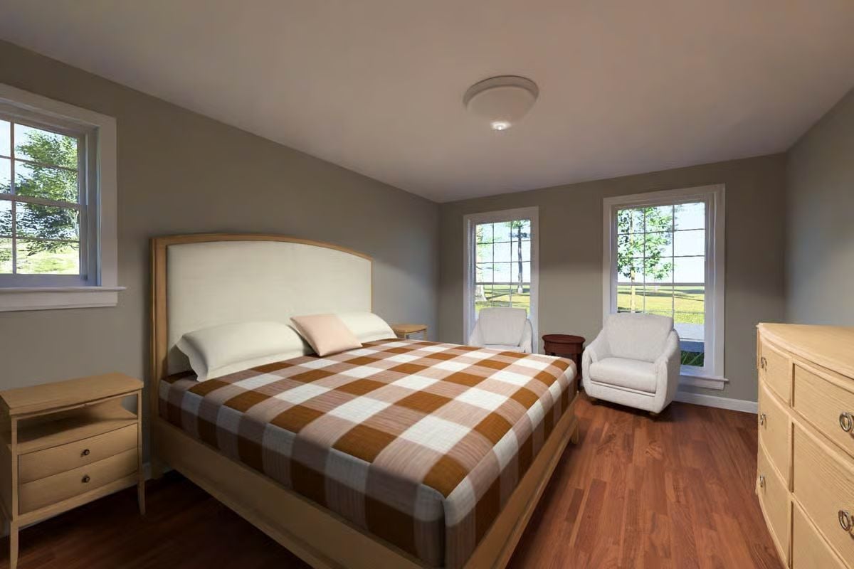 Plaid Bedding and Warm Wood Floors Give This Master Bedroom Actual Personality