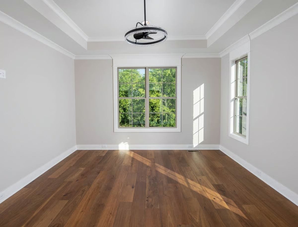 Dark Hardwood and a Tray Ceiling That Justify the Whole Floor Plan