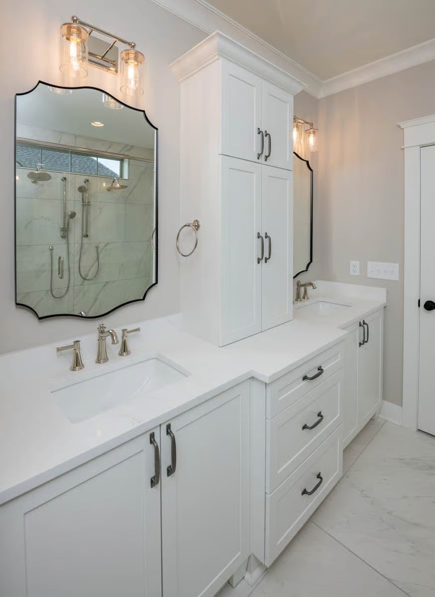Scalloped Mirrors and a Tower Cabinet That Divides the Vanity Without Crowding It