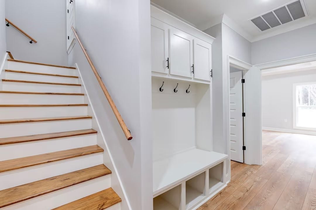 Built-In Mudroom Bench Earns Its Keep Right Off the Staircase