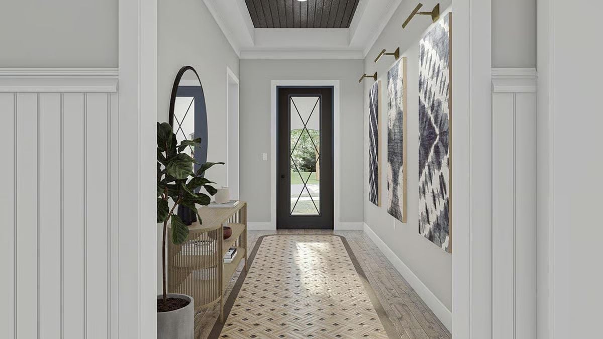 Dark Ceiling, Oval Mirror, and Textile Wall Art Walk Into a Foyer
