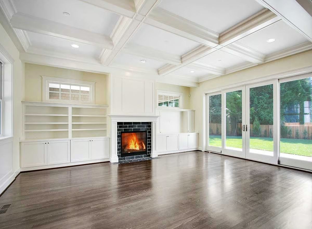 Built-Ins Flanking a Black Brick Fireplace Make Empty Look Intentional