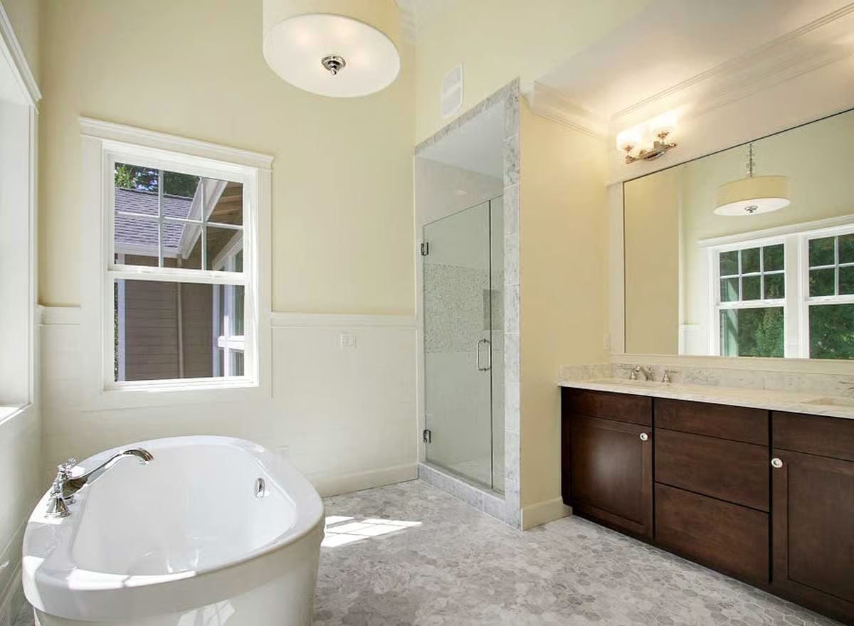 Freestanding Soaker Tub Positioned Where Morning Light Hits First
