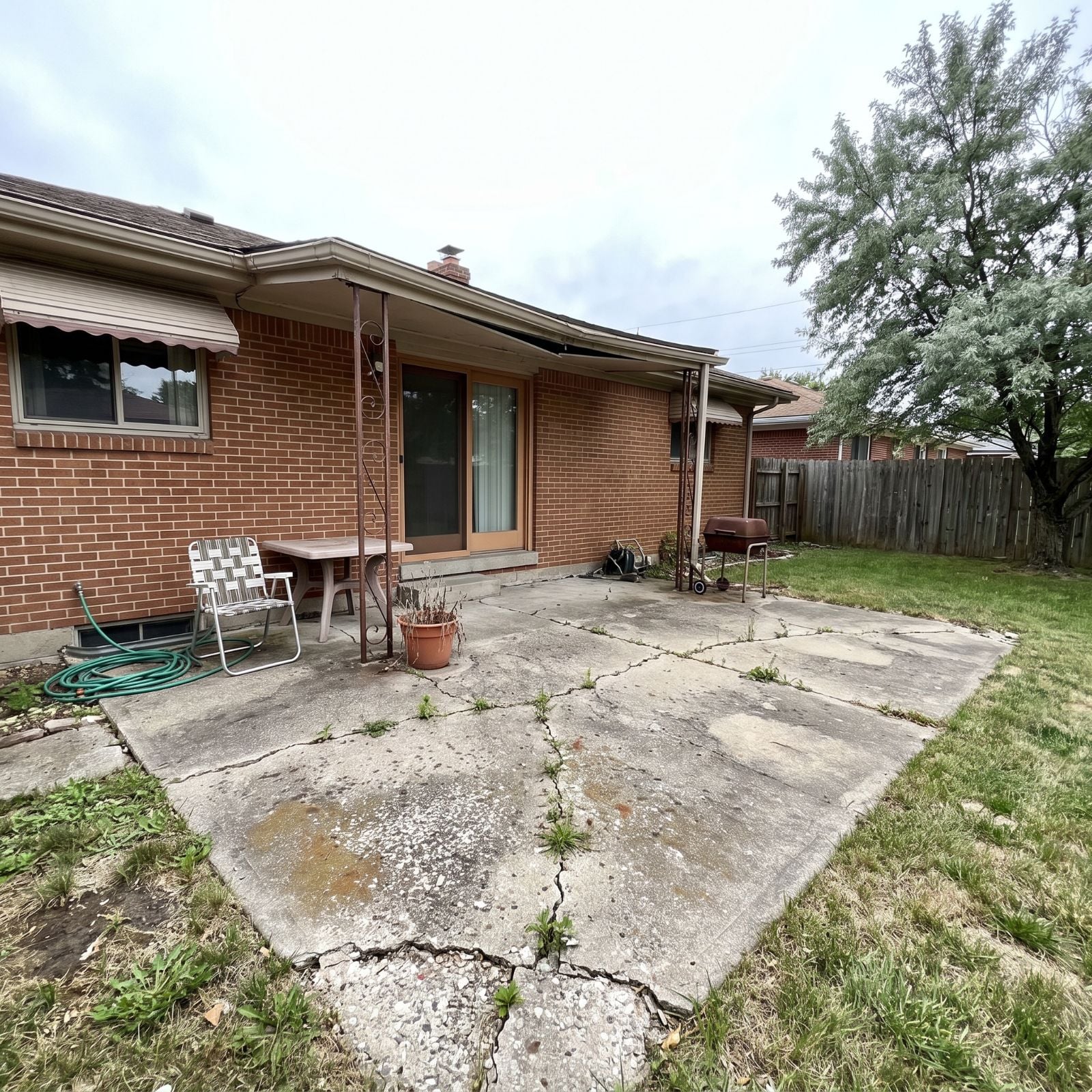 This Cracked, Crumbling 1970s Concrete Patio Was an Eyesore Nobody Used — See the 26 Before & After Design Ideas