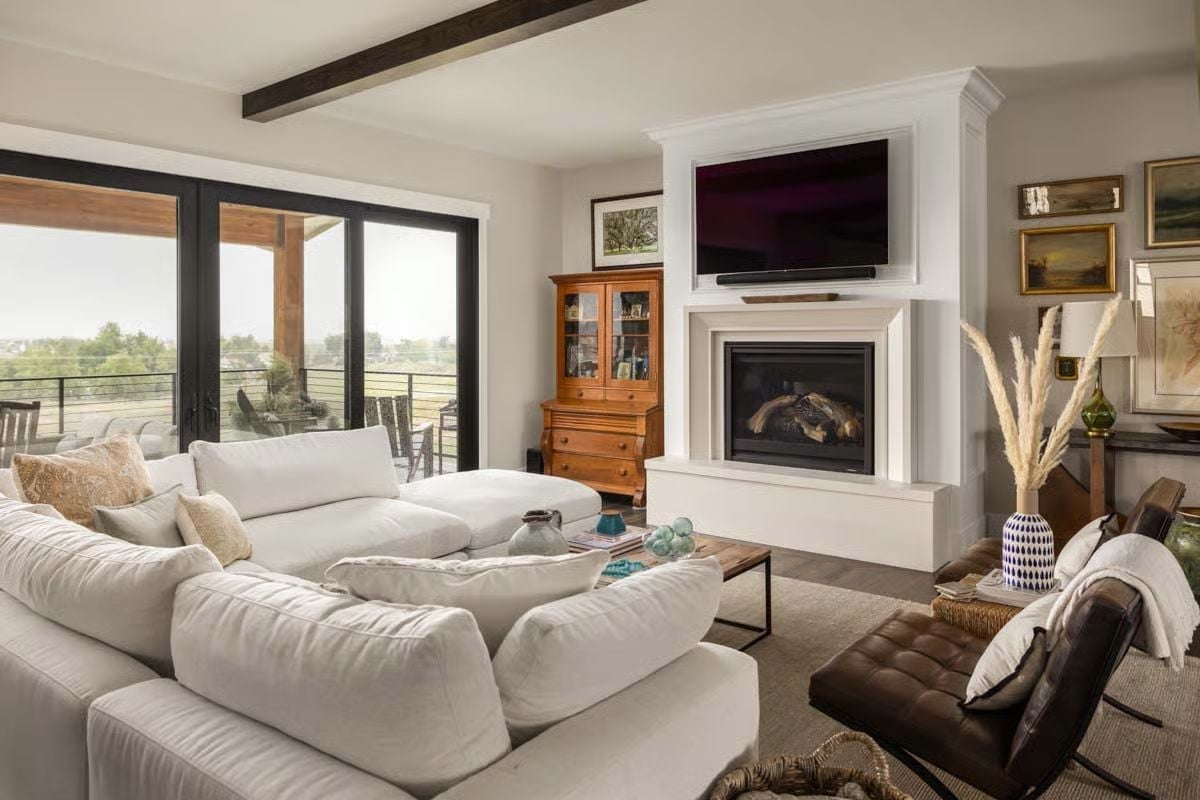 White Sofas, Warm Wood, and a Fireplace That Earns Its Keep