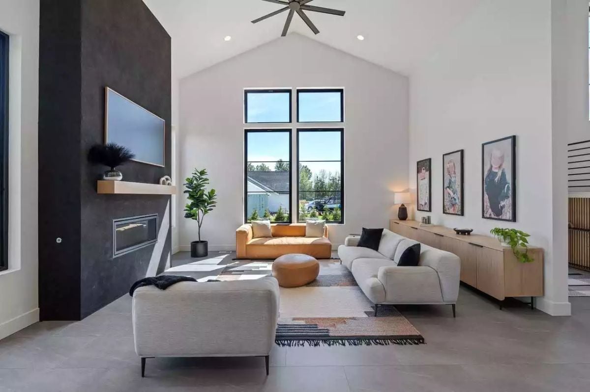 Cathedral Ceilings and a Dark Plaster Wall Anchor This Family Room