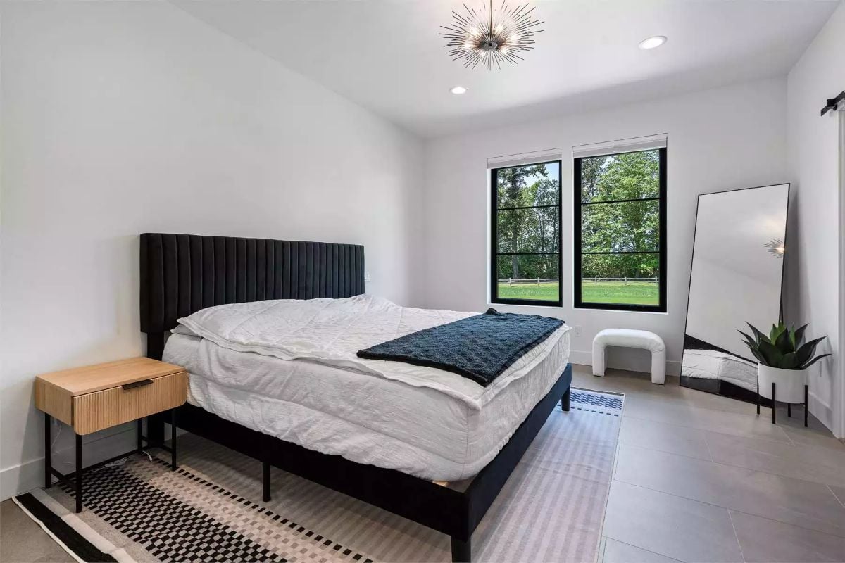 Channeled Velvet Headboard and a Sputnik Fixture Set the Tone Here