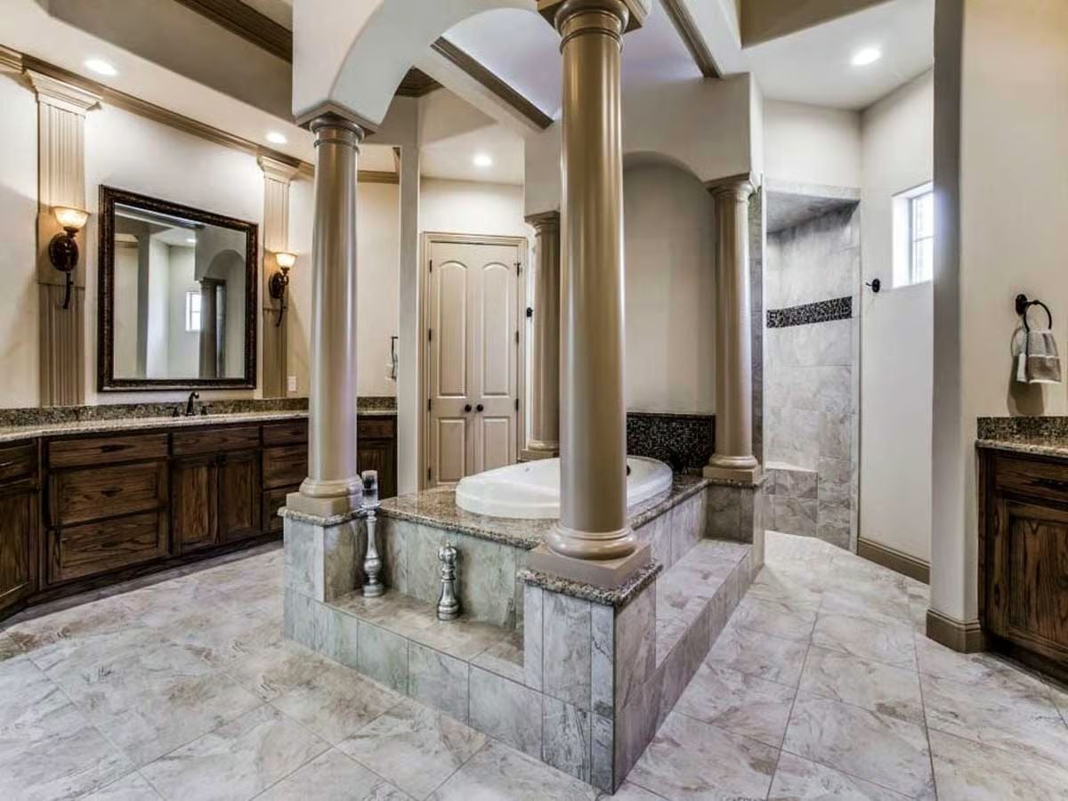 Columns Around the Tub Because Some Bathrooms Earn the Drama