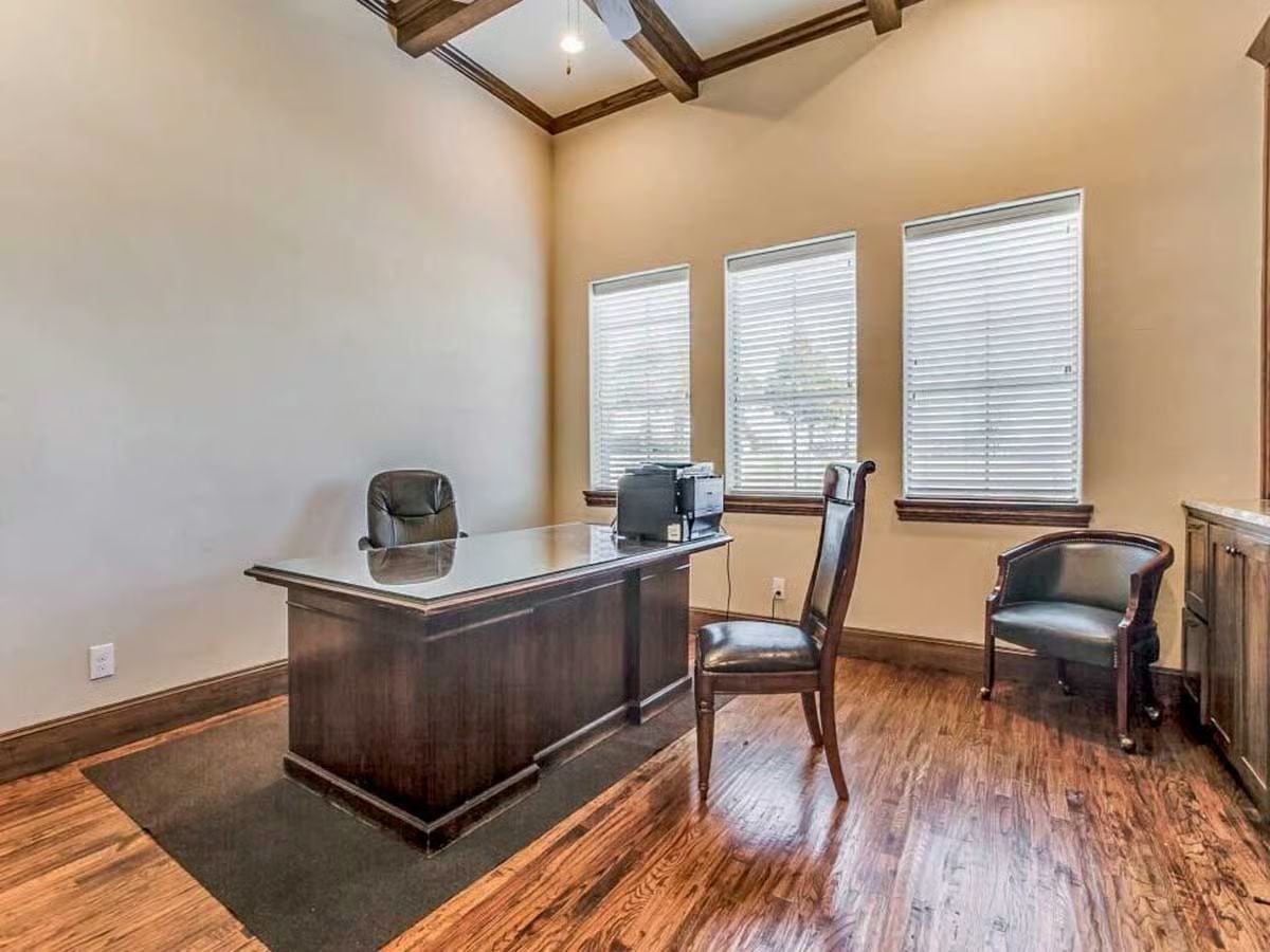 Dark Leather, Coffered Beams, and a Desk Built for Decisions