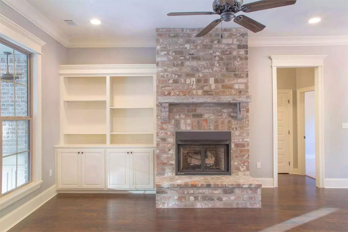 Whitewashed Brick Gets a Rustic Mantel and Doesn't Apologize for It