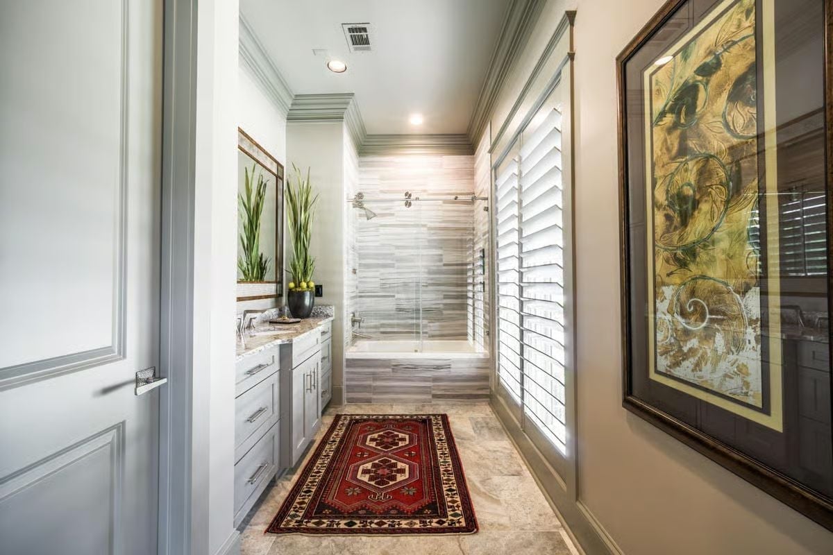 Kilim Runner and Glass-Enclosed Tub Give This Bath Its Personality