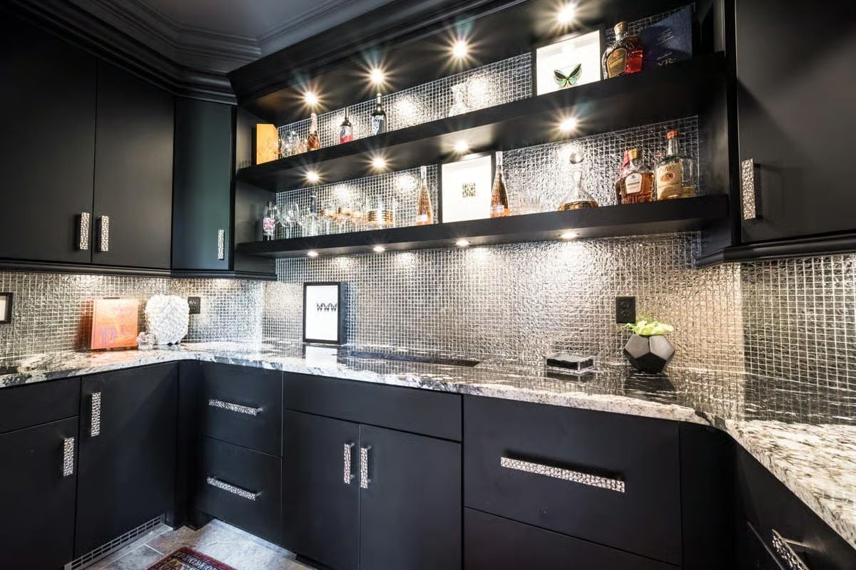 Mirrored Mosaic Backsplash and Floating Shelves Built for a Serious Bottle Collection