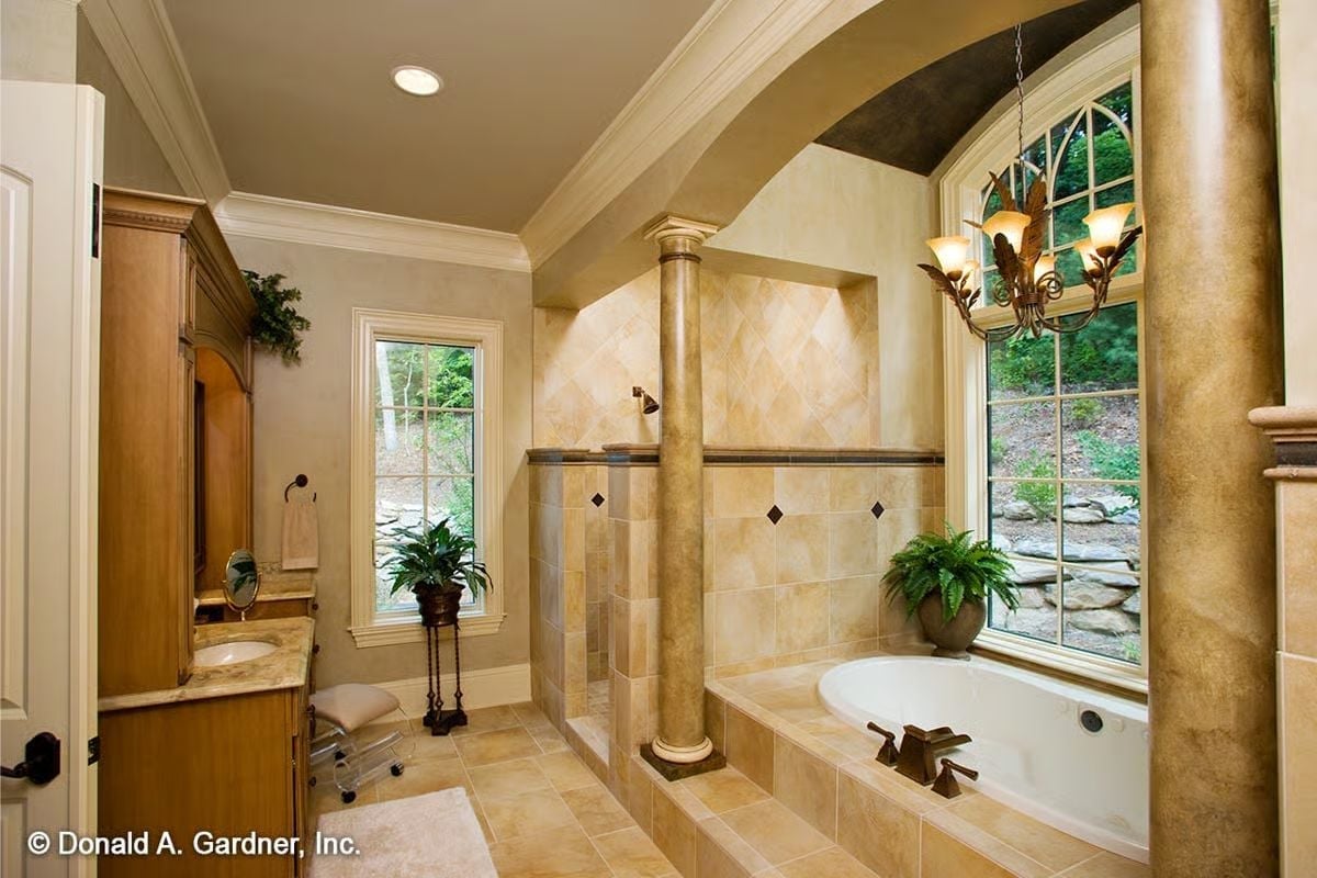 Columns and an Arched Alcove Give This Master Bath a Sense of Ceremony