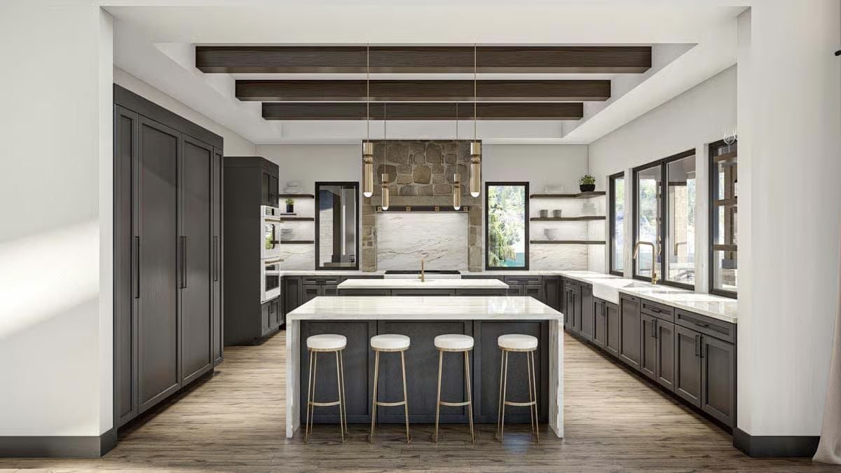Dark Cabinetry and Gold Hardware Pull This Kitchen Out of Safe Territory