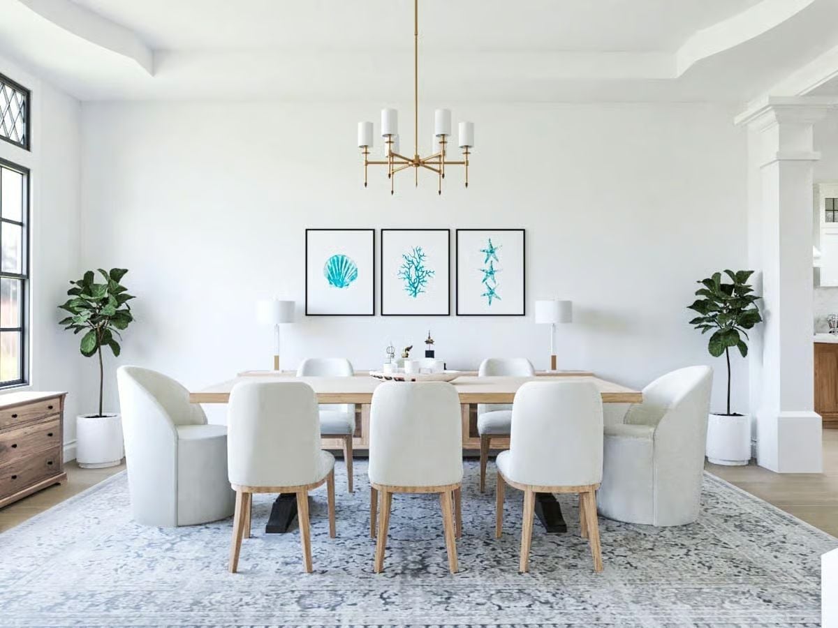 Cream Chairs and Coastal Art in a Dining Room That Knows Its Own Mind