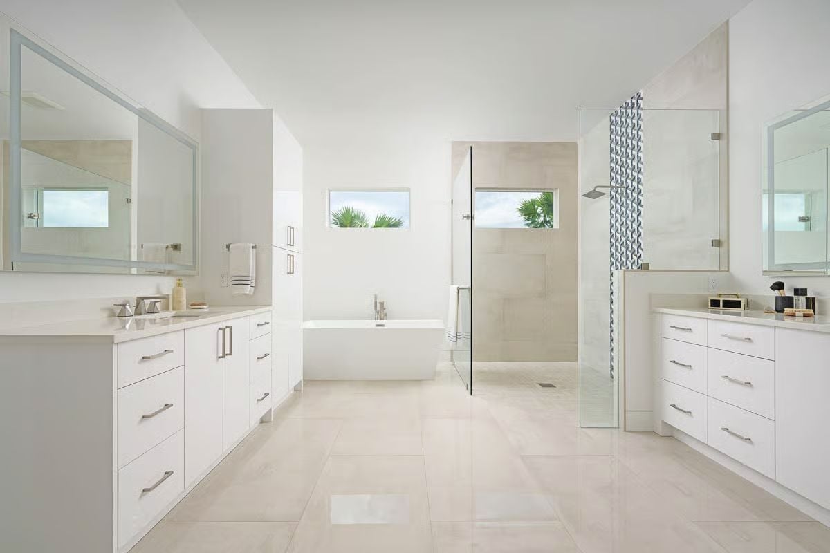 Dual Vanities Frame a Freestanding Soaker Tub Built for Two Schedules