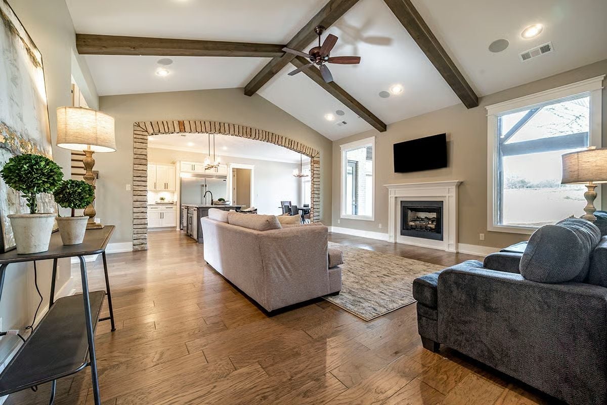 Exposed Ceiling Beams and a Brick Arch Walk Into the Same Room and It Works