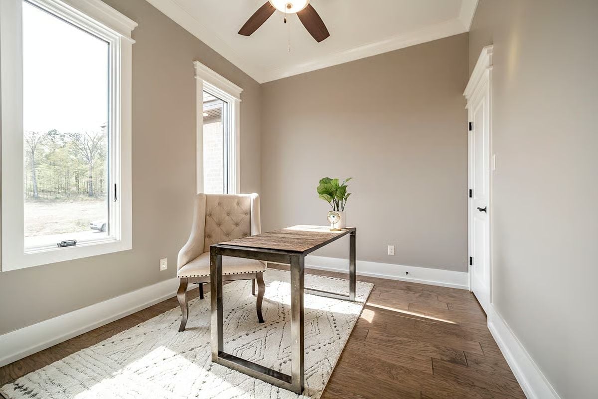 Sunlit Home Office Where the Metal Desk Frame Earns Its Keep