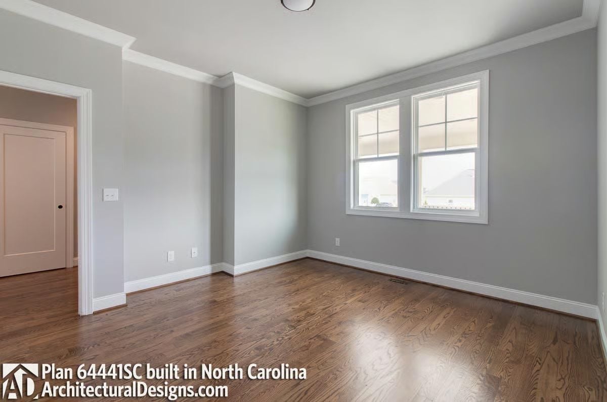 Crown Molding, Dark Hardwood, and Room to Breathe