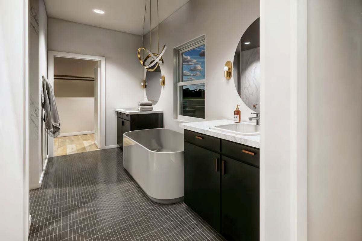 Gold Hardware, a Freestanding Tub, and Dark Cabinetry That Earns Its Drama
