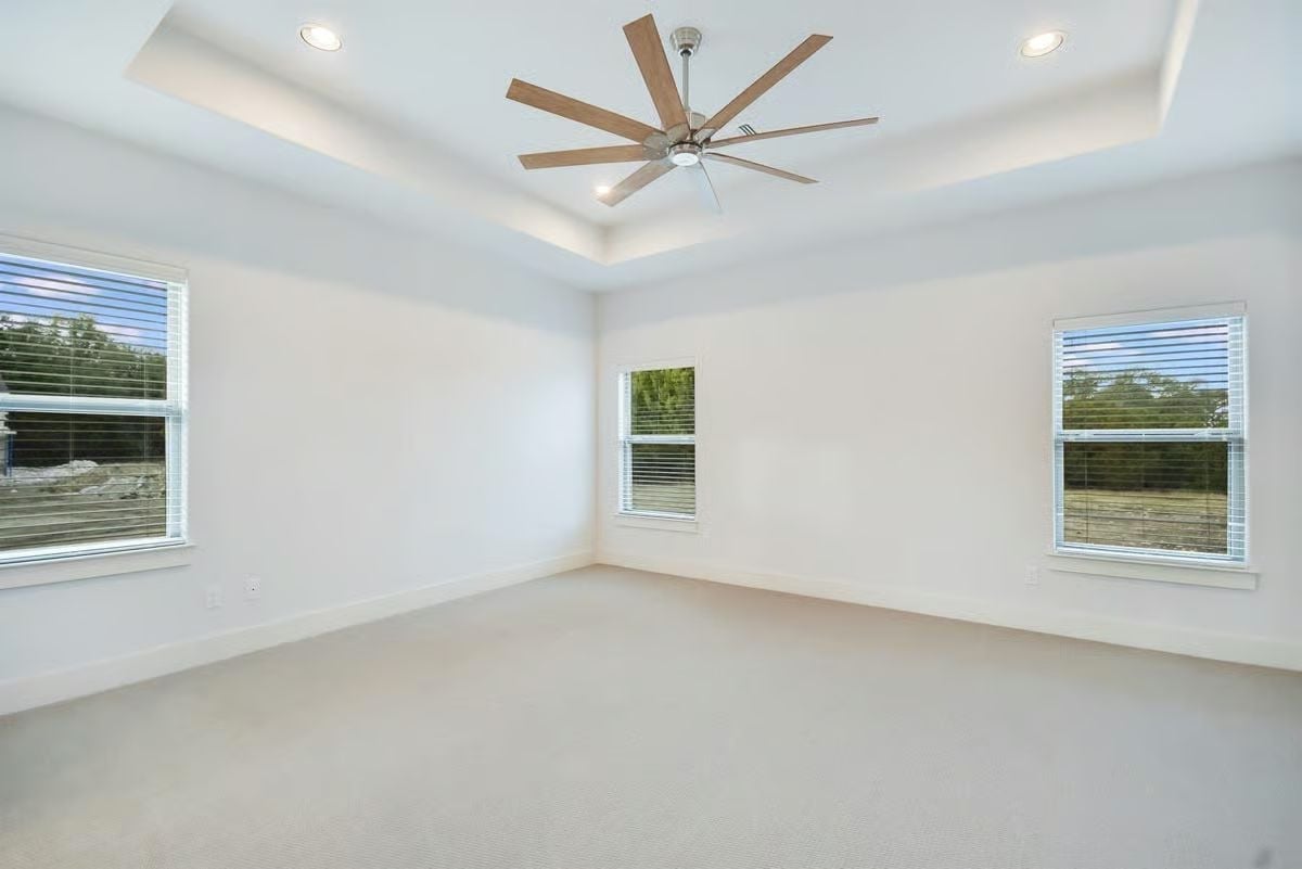 Eight-Blade Ceiling Fan Centers a Tray Ceiling Built for a Room This Size